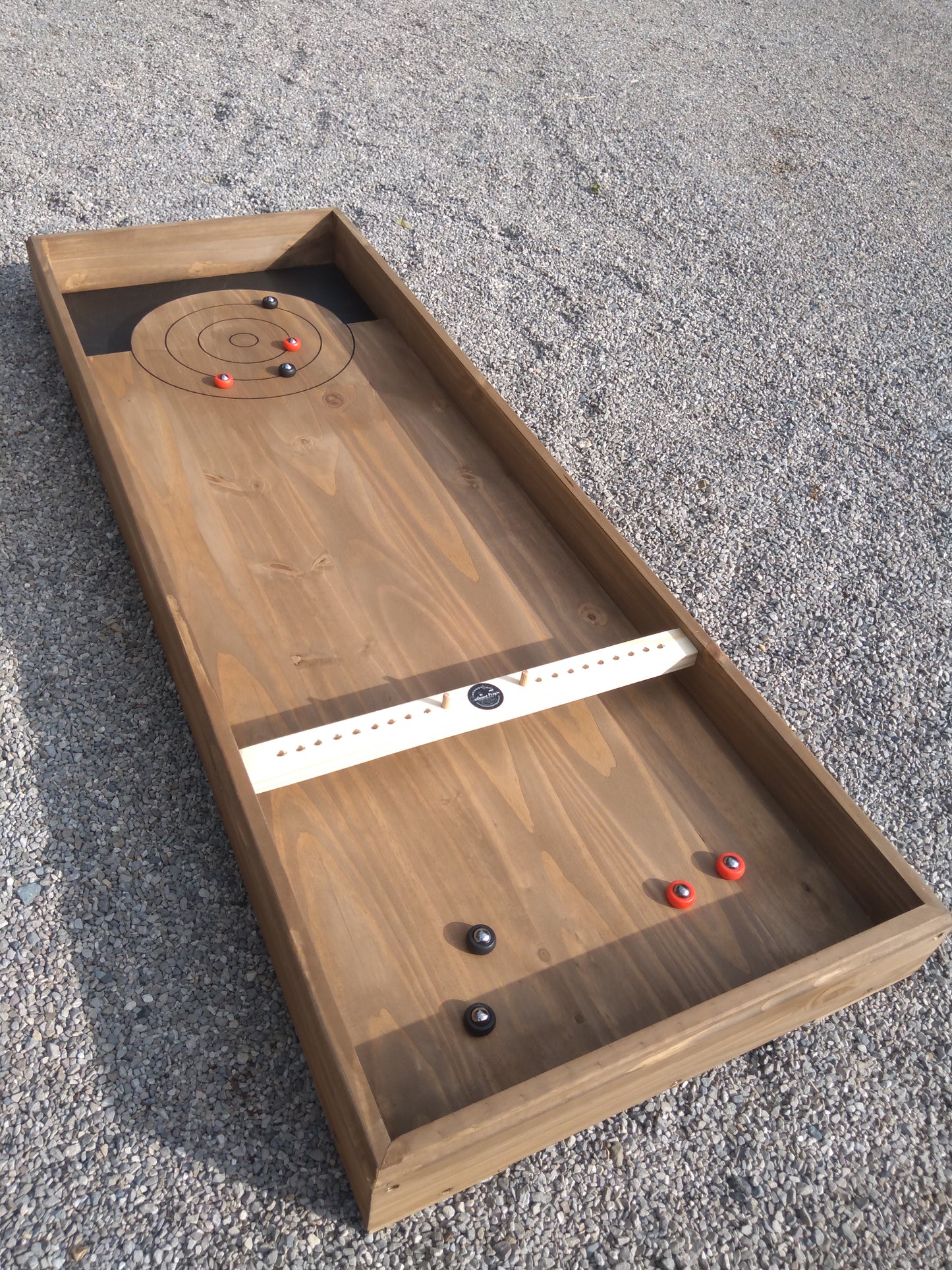 Jeu de curling disponible à la location (non expediable)